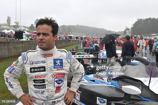 Pedro Lamy, driver of the Team Peugeot Total Peugeot 908 looking over the grid prior to the start of the American Le Mans Series Petit Le Mans at...