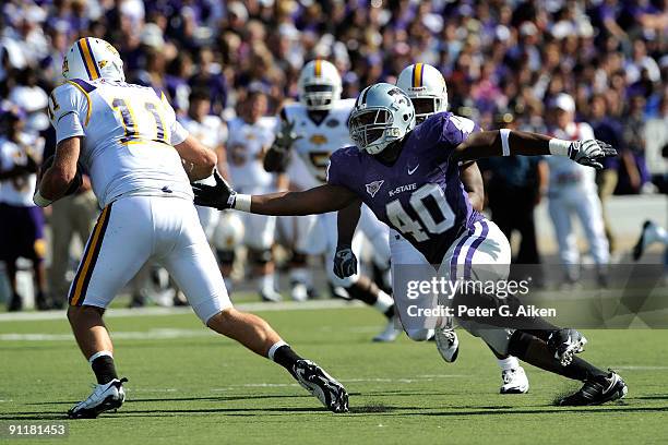 Defensive end Antonio Felder of the Kansas State Wildcats reaches to sack quarterback Lee Sweeney of the Tennessee Tech Golden Eagles during the...