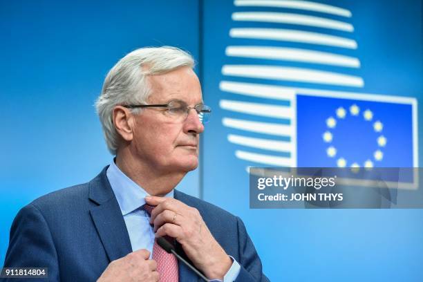 European Union Chief Negotiator in charge of Brexit negotiations, Michel Barnier adjusts his tie as he gives a press after a General affairs council...