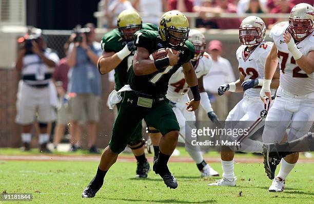 Quarterback B.J. Daniels of the South Florida Bulls runs the ball against the Florida State Seminoles during the game at Doak Campbell Stadium on...
