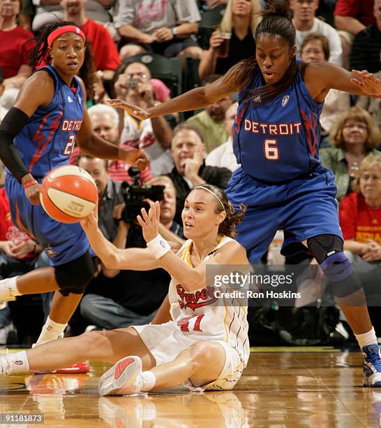 Tully Bevilaqua of the Indiana Fever battles Nikki Teasley and Alexis Hornbuckle of the Detroit Shock during Game Three of the Eastern Conference...