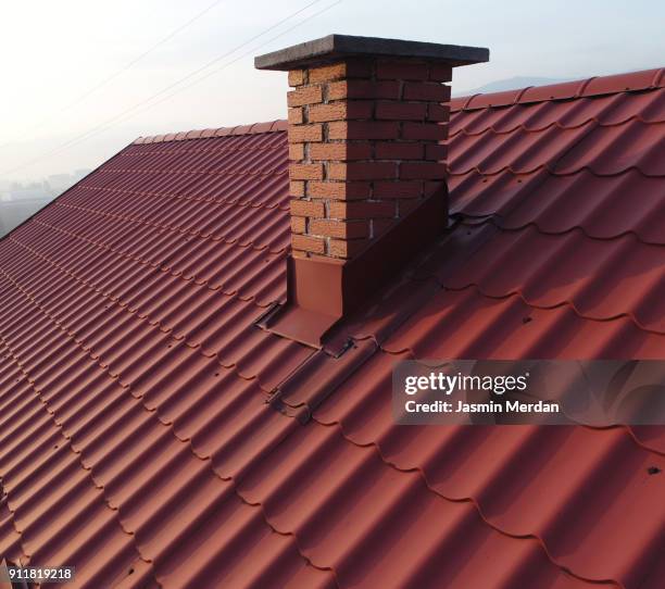 roofs with chimney aerial view - daktegel stockfoto's en -beelden