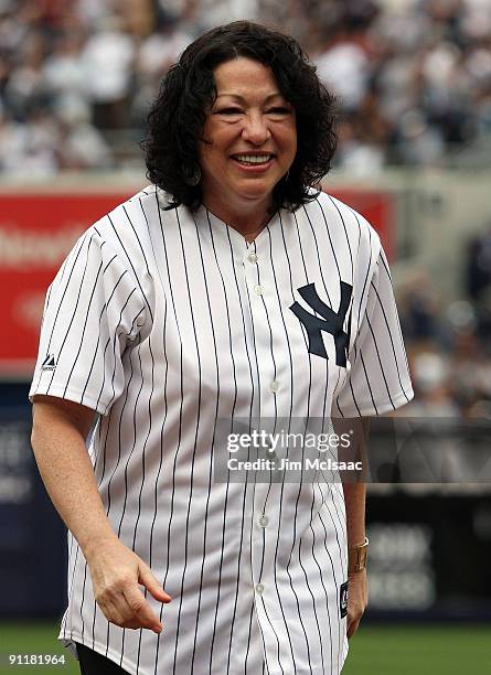 United States Supreme Court Justice Sonia Sotomayor smiles after throwing out the ceremonial first pitch before the New York Yankees play the Boston...