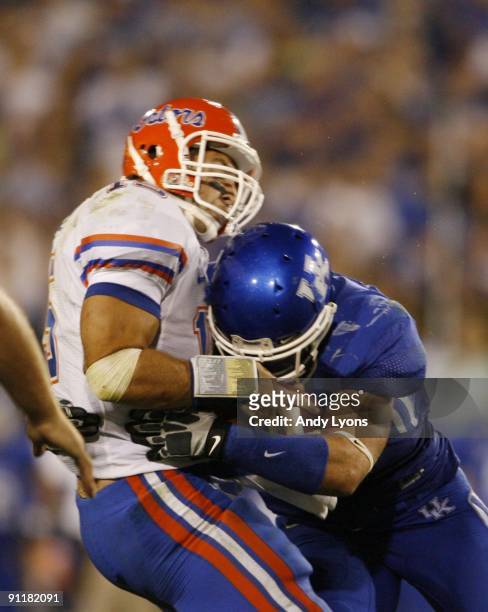 Quarterback Tim Tebow of the Florida Gators is sacked by Taylor Wyndham of the Kentucky Wildcats during the third quarter of the game at Commonwealth...