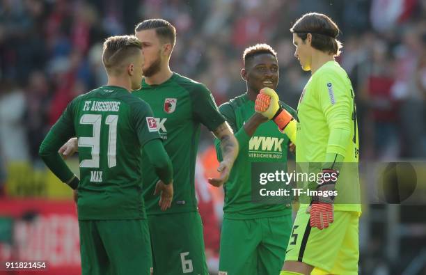 Philipp Max of Augsburg, Jeffrey Gouweleeuw of Augsburg, Daniel Opare of Augsburg and Goalkeeper Marvin Hitz of Augsburg look on prior to the...