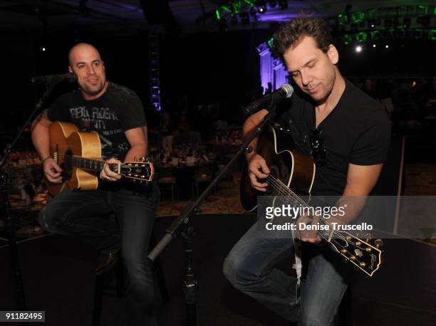 Singer/guitarist Chris Daughtry and comedian/actor Dane Cook rehearse for the 14th annual Andre Agassi Foundation for Education's Grand Slam for...