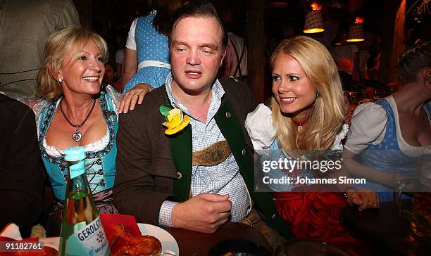 Alexander zu Schaumburg-Lippe , his wife Nadja Anna zu Schaumburg-Lippe and Sabine Christiansen attend the Oktoberfest beer festival at Kaefer...