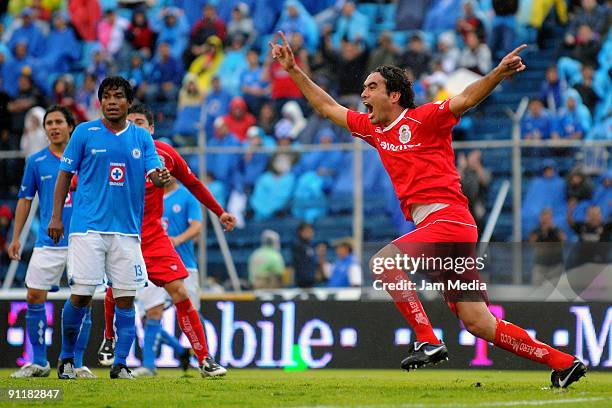 Toluca's Edgar Duenas celebrates his scored goal during their match against Cruz Azul in the 2009 Opening tournament, the closing stage of the...
