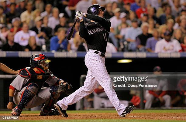 Brad Hawpe of the Colorado Rockies watches his two run homer off of starting pitcher Adam Wainright of the St. Louis Cardinals to tie the score 3-3...
