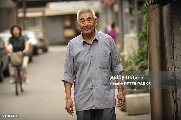 China-politics-60years-history,INTERVIEW by Dan Martin This photo taken on September 14, 2009 shows 79-year-old Geng Zhifeng posing outside the tiny...