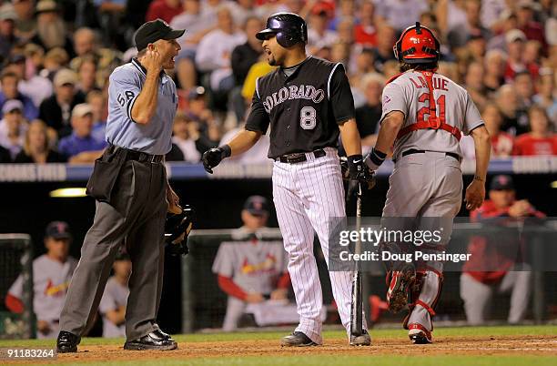 Catcher Yorvit Torrealba of the Colorado Rockies argues a third strike with homeplate umpire Dan Iassogna to end the fifth inning against the St....