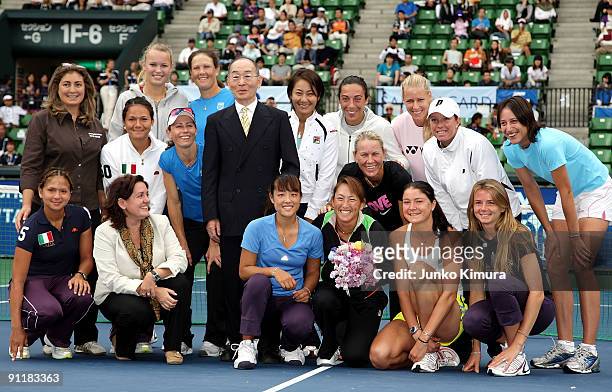 Ai Sugiyama of Japan poses with fellow players during a special ceremony on day one of the Toray Pan Pacific Open Tennis tournament at Ariake...