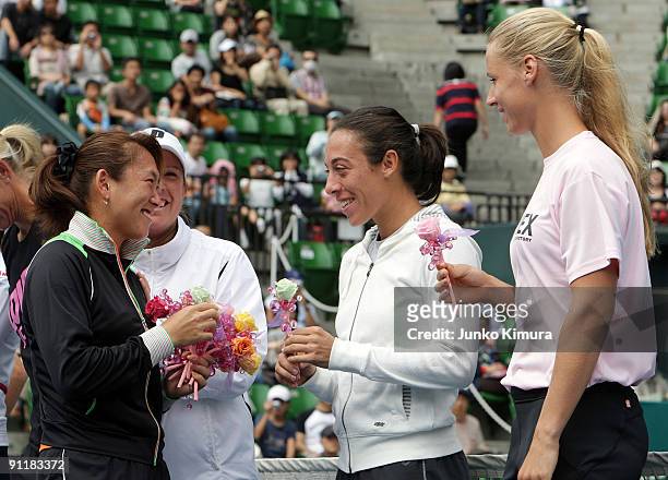 Ai Sugiyama of Japan greets fellow players during a special ceremony on day one of the Toray Pan Pacific Open Tennis tournament at Ariake Colosseum...