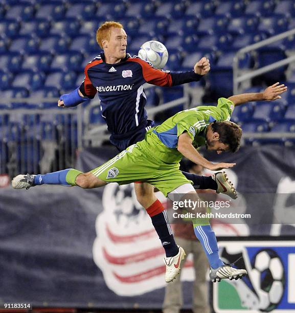 Jeff Larentowicz of the New England Revolution collides with Brad Evans of the Seattle Sounders FC during a MLS match on September 26, 2009 at...