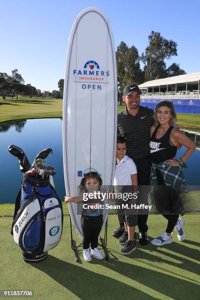 Jason Day of Australia poses with his wife, Ellie Day, his children, Dash and Lucy, after winning the Farmers Insurance Open on the sixth playoff...