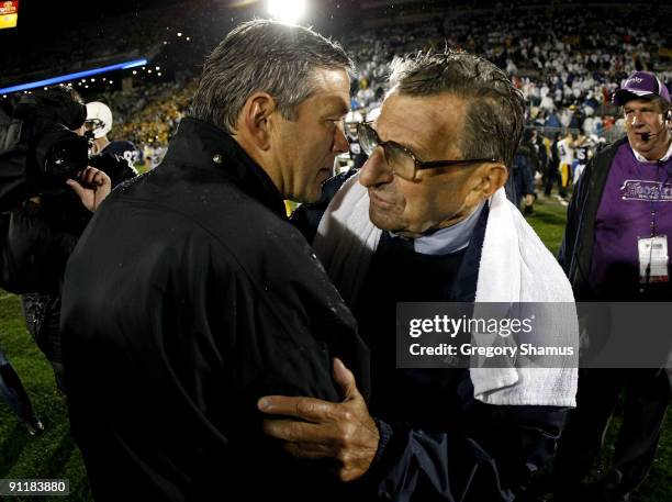 Head coach Kirk Ferentz of the Iowa Hawkeyes shakes hands with head coach Joe Paterno of the Penn State Nittnay Lions after defeating them 21-10 on...