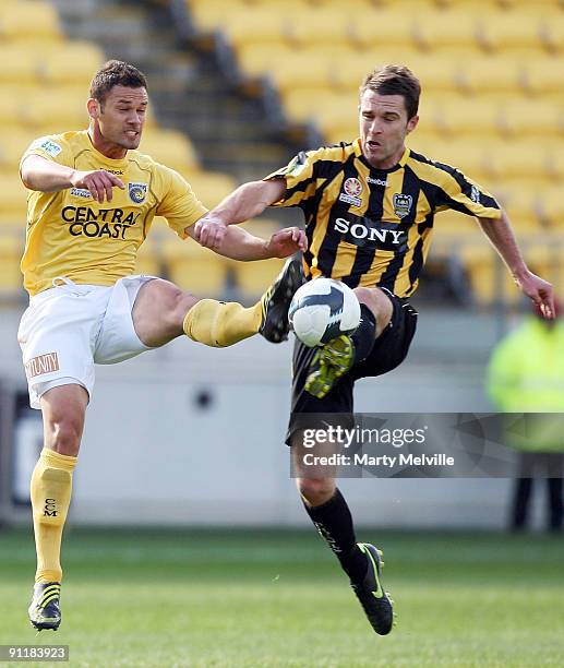 Tim Brown of the Phoenix is tackled by Bojic Pedj of the Mariners during the round eight A-League match between the Wellington Phoenix and the...