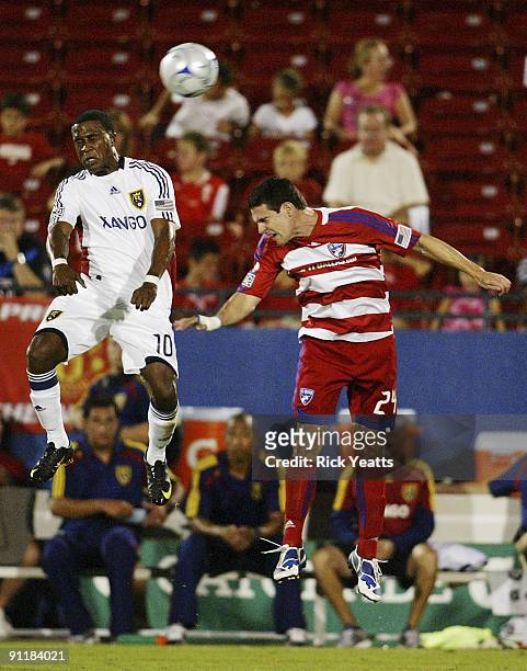 Robbie Findley of Real Salt Lake and Heath Pearce of the FC Dallas compete for a header at Pizza Hut Park on September 26, 2009 in Frisco, Texas.