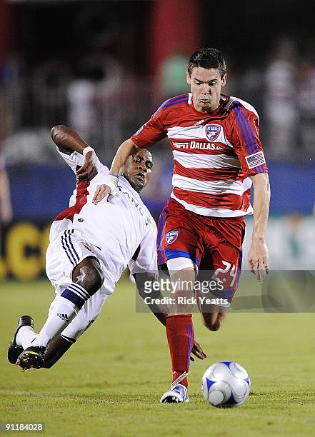 Heath Pearce of the FC Dallas defends the ball from Robbie Findley of Real Salt Lake at Pizza Hut Park on September 26, 2009 in Frisco, Texas.