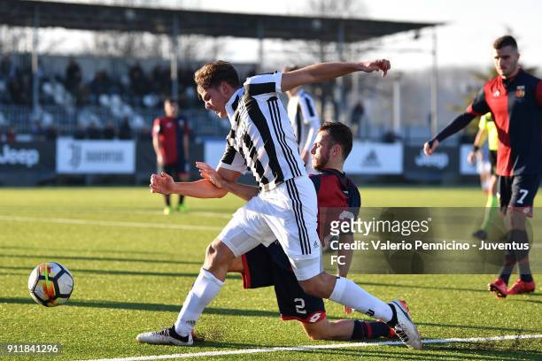 Alessandro Tripaldelli of Juventus U19 is tackled by Matteo Piccardo of Genoa U19 during the U19 match between Juventus and Genoa at Juventus Center...