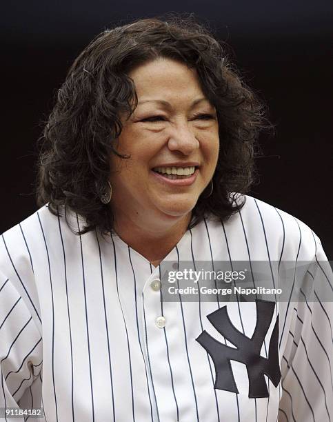 Supreme Court Justice Sonia Sotomayor throws out the first pitch at Yankee Stadium on September 26, 2009 in New York City.