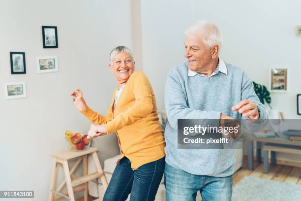 young at heart - senior women dancing stock pictures, royalty-free photos & images