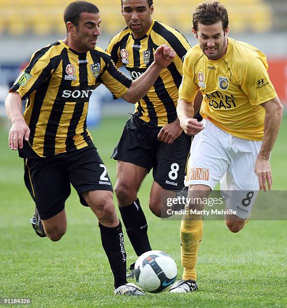 Dean Heffernan of the Mariners is tackled by Manny Muscat of the Phoenix during the round eight A-League match between the Wellington Phoenix and the...