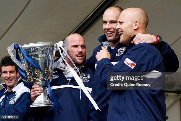 Paul Chapman, Tom Harley and Gary Ablett of the Cats sing the club song to the crowd during the Geelong Cats AFL Grand Final reception at Skilled...
