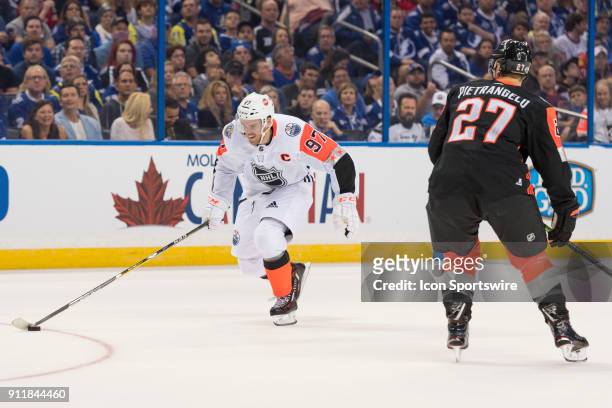 Pacific Division forward Connor McDavid is defended by Central Division defender Alex Pietrangelo during the first game of the NHL All-Star Game...