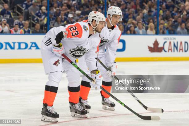 Pacific Division defender Oliver Ekman-Larrson and Pacific Division forward Johnny Gaudreau wait for the face-off during the first game of the NHL...