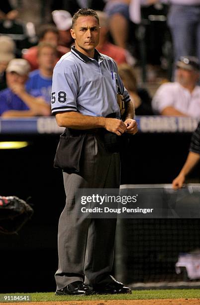 Homeplate umpire Dan Iassogna oversees the action between the Colorado Rockies and the St. Louis Cardinals at Coors Field on September 26, 2009 in...