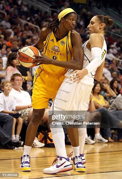 DeLisha Milton-Jones of the Los Angeles Sparks controls the ball under pressure from Diana Taurasi of the Phoenix Mercury during Game Two of the...