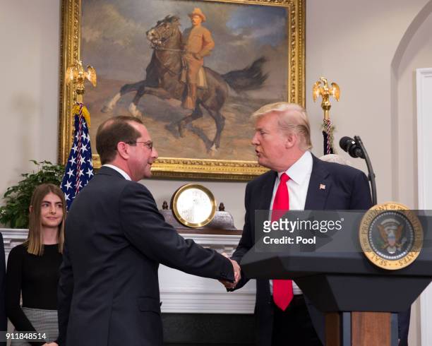 President Donald J. Trump greets Alex Azar at his swearing-in ceremony to become the new Secretary of the Department of Health and Human Services on...