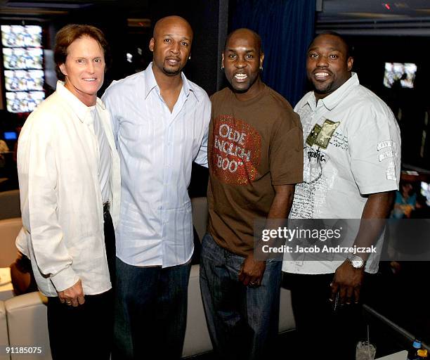 Bruce Jenner, basketball player Craig Smith, basketball player Gary Payton and football player Warren Sapp pose at Lagasse's Stadium VIP grand...