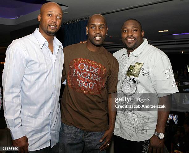 Basketball player Craig Smith, basketball player Gary Payton and football player Warren Sapp pose at Lagasse's Stadium VIP grand opening at The...