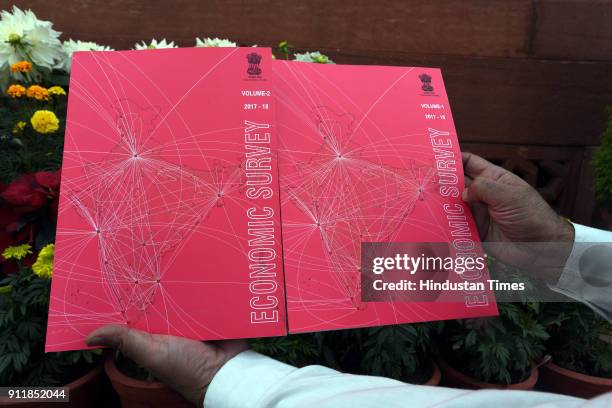 Man shows the Economic Survey Book of the year 2017-18 during the first day of Parliament Budget Session, on January 29, 2018 in New Delhi, India....