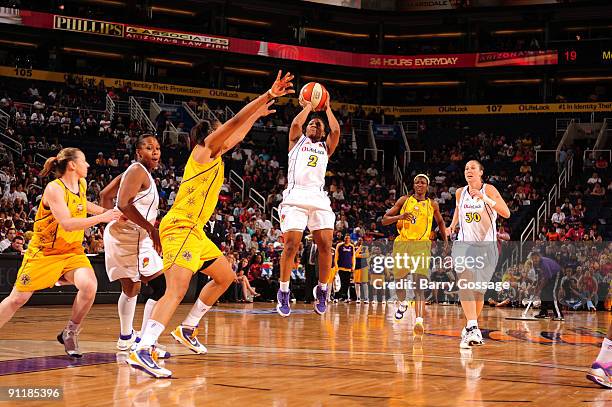 Temeka Johnson of the Phoenix Mercury shoots against Tina Thompson of the Los Angeles Sparks in Game Three of the WNBA Western Conference Finals...