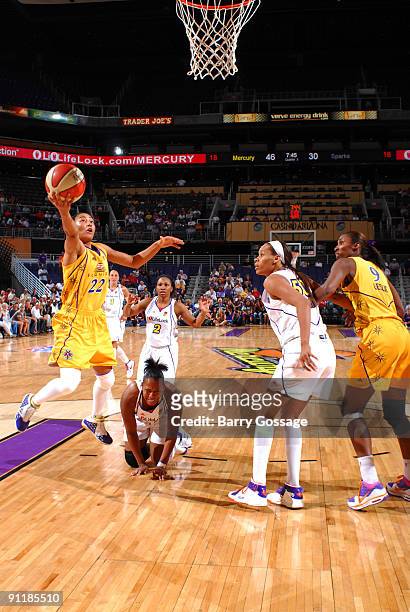 Betty Lennox of the Los Angeles Sparks shoots against Tangela Smith of the Phoenix Mercury in Game Three of the WNBA Western Conference Finals played...