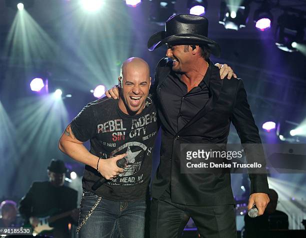 Singer Chris Daughtry of the band Daughtry and recording artist Tim McGraw perform during the 14th annual Andre Agassi Foundation for Education's...