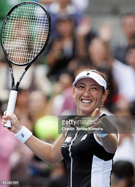 Ai Sugiyama of Japan acknowledges the crowd after playing her doubles match with Daniela Hantuchova of Slovakia against Vania King of the USA and Jie...