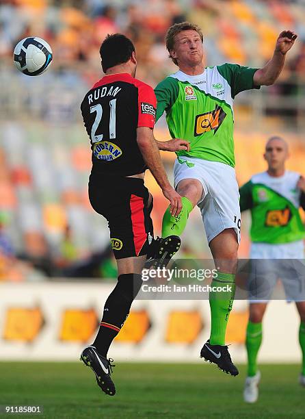 Daniel McBreen of the Fury competes for the ball with Mark Rudan of Adelaide during the round eight A-League match between the North Queensland Fury...