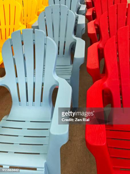 rows of colorful adirondack chairs for sale - adirondack chair closeup stock pictures, royalty-free photos & images