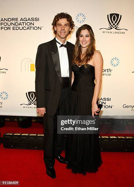 Tennis player Gustavo Kuerten and Mariana Somcini arrive at the 14th annual Andre Agassi Charitable Foundation's Grand Slam for Children benefit...