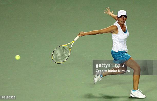 Roberta Vinci of Italy plays a backhand in her match against Flavia Pennetta of Italy during day one of the Toray Pan Pacific Open Tennis tournament...