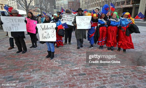 Participants march from City Hall Plaza to the John F. Kennedy Federal Building in Boston on Jan. 26, 2018 as the Haitian American community in...