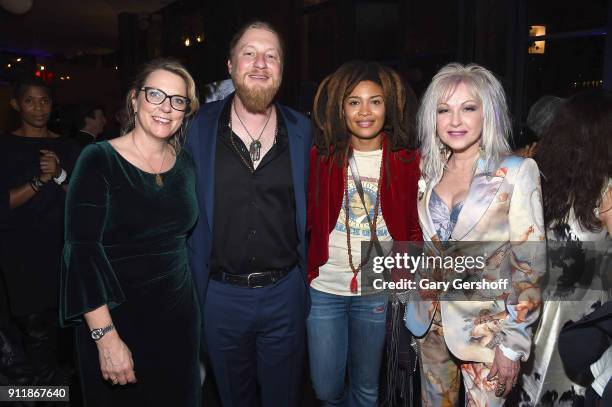 Recording artists Susan Tedeschi, Derek Trucks, Valerie June and Cyndi Lauper attend the Concord Music Group Grammy party at Bryant Park Grill on...