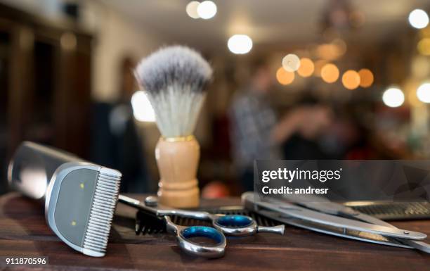 close-up on a set of shaving tools at a barber shop - electric razor stock pictures, royalty-free photos & images