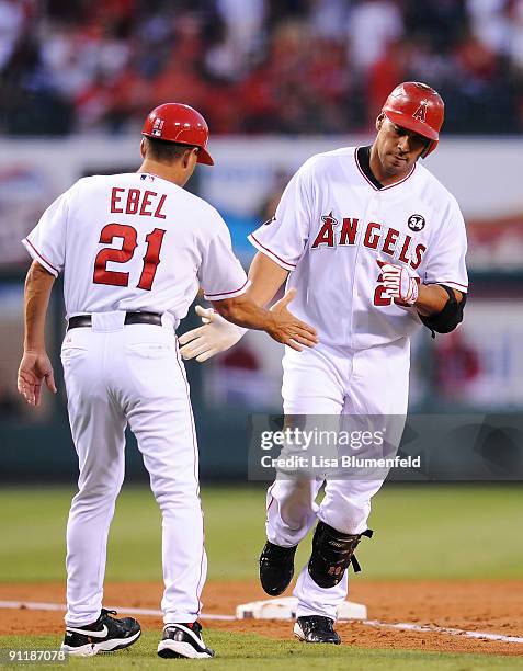 Juan Rivera of the Los Angeles Angels of Anaheim runs the bases after hitting a three run homerun in the first inning against the Oakland Athletics...