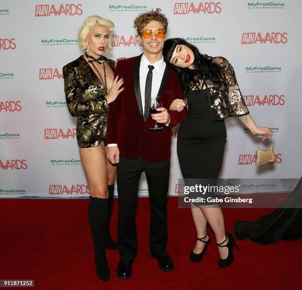 Adult film actress Bella Bathory, adult film actor Michael Vegas and adult film actress Siousie Q attend the 2018 Adult Video News Awards at the Hard...
