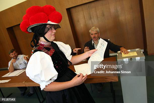 Claudia Lutz of Kirnbacher Kurrende Black Forest costume club arrives for casting her vote for the German federal elections on September 27, 2009 in...